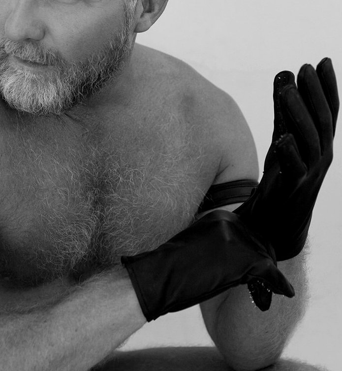 Court Vox preparing — putting on leather gloves